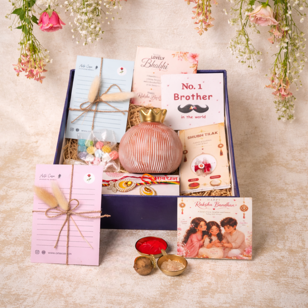 Artecasa Pink Pomegranate Rakhi Gift Hamper | Premium Bhai Bhabhi Raksha Bandhan Gift Hamper with Decorative Vase, Rakhi Set & Festive EssentialsArtecasa Pink Pomegranate Rakhi Gift Hamper | Premium Bhai Bhabhi Raksha Bandhan Gift Hamper