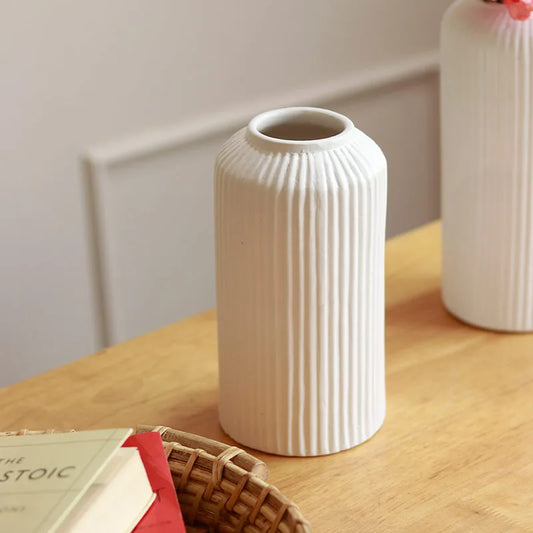 Close up of white Matt Ribbed ceramic vase with textured finish