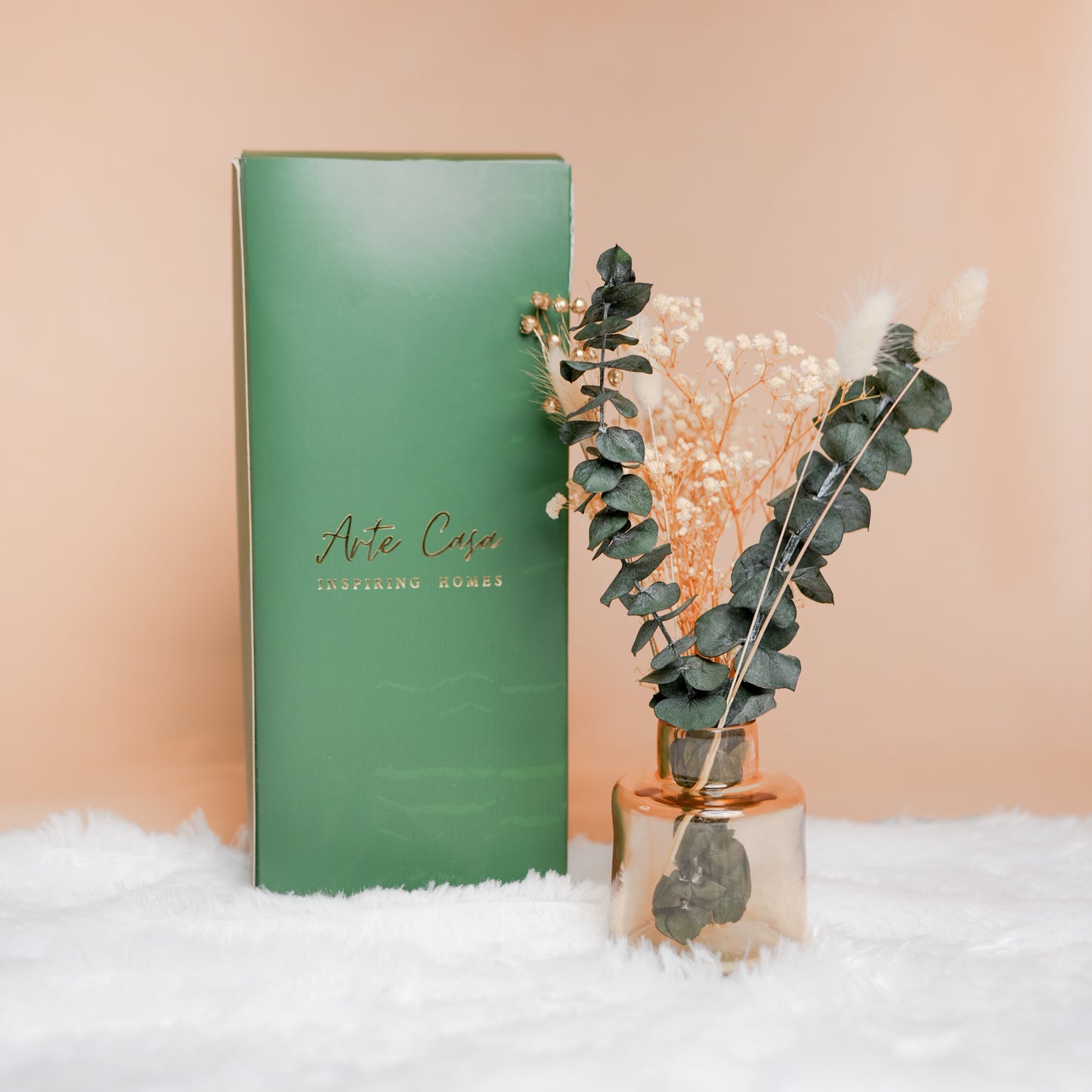 little blossom vase with dried flower bunch in mini glass vase