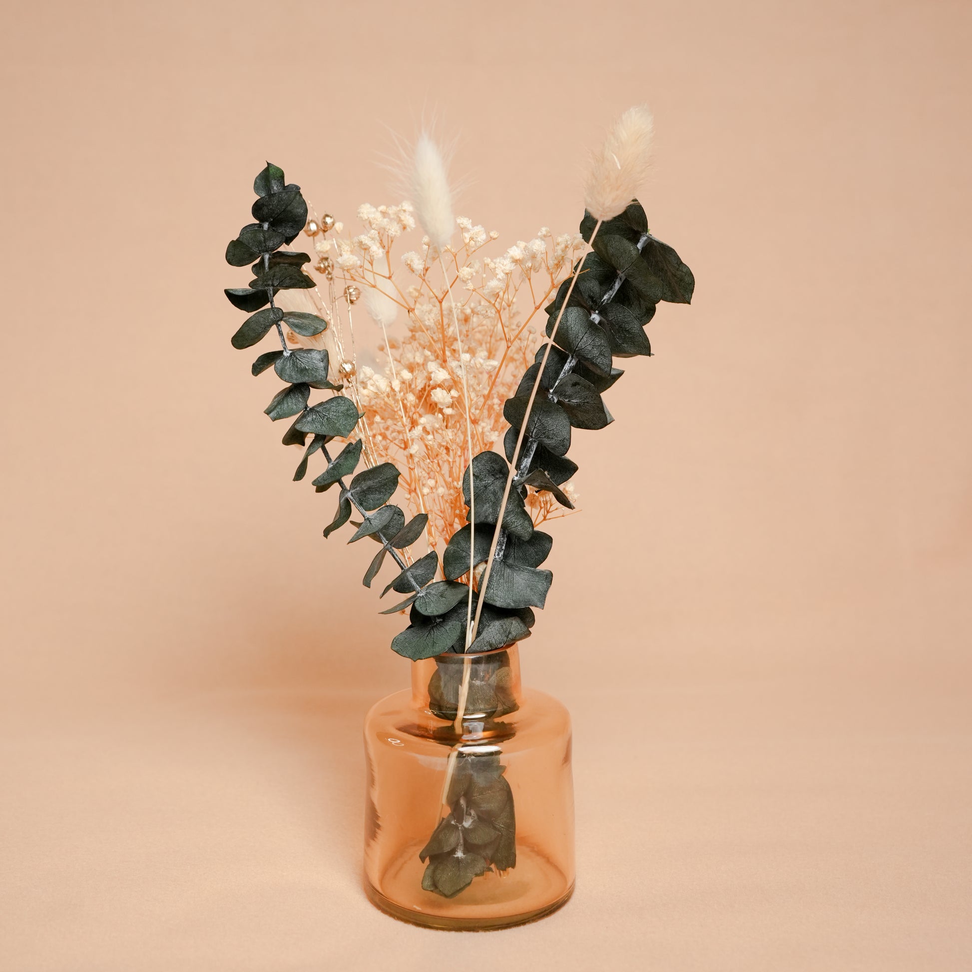 little blossom vase with dried flower bunch in mini glass vase