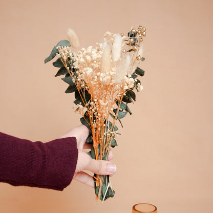 little blossom vase with dried flower bunch in mini glass vase