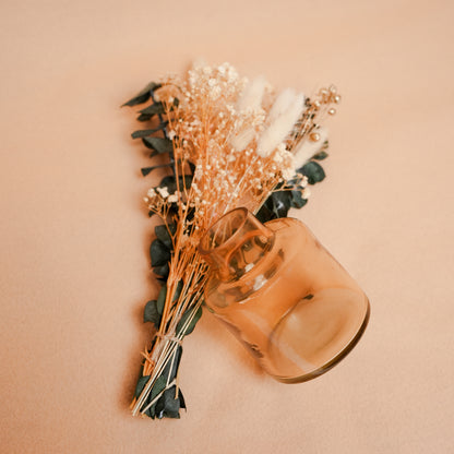 little blossom vase with dried flower bunch in mini glass vase