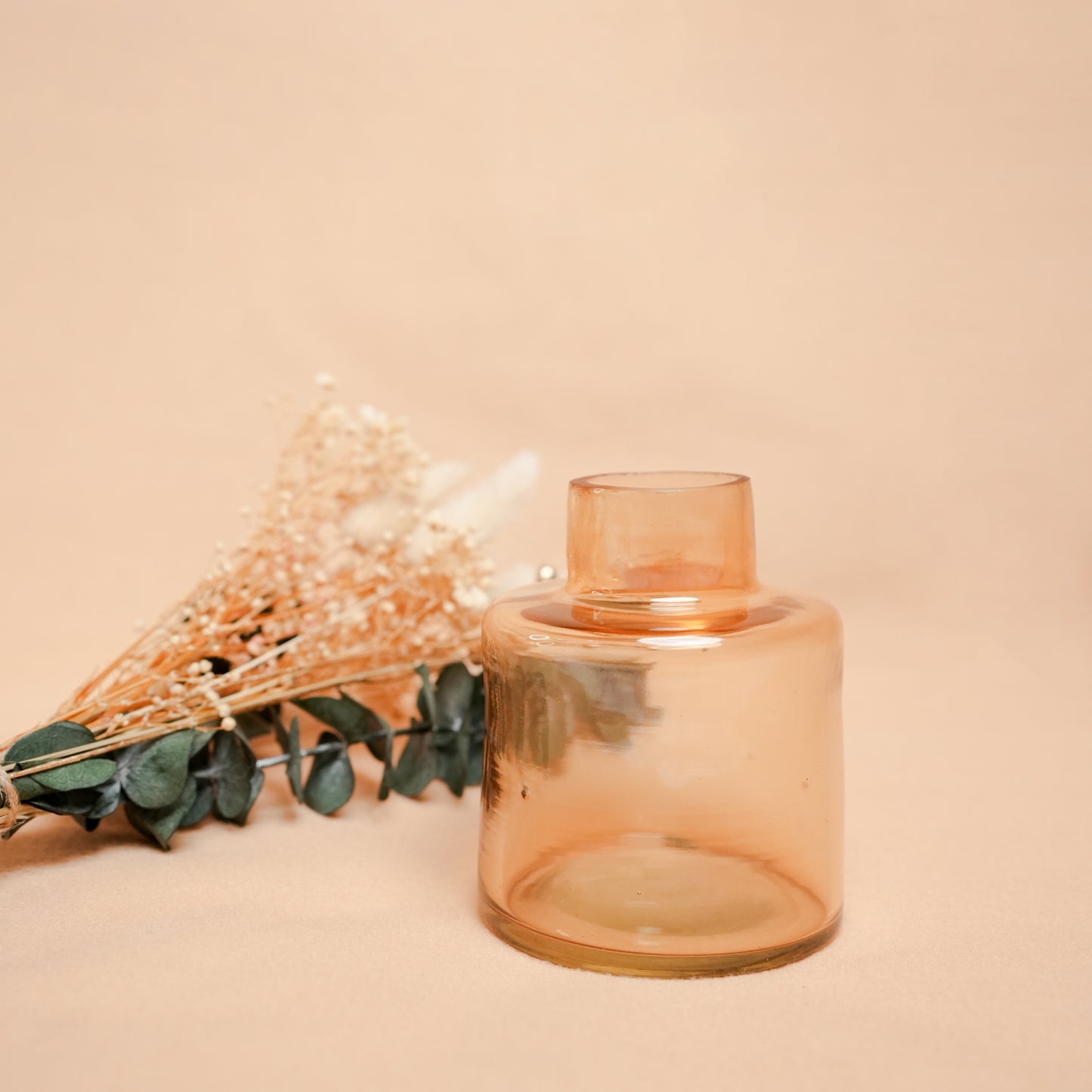 little blossom vase with dried flower bunch in mini glass vase