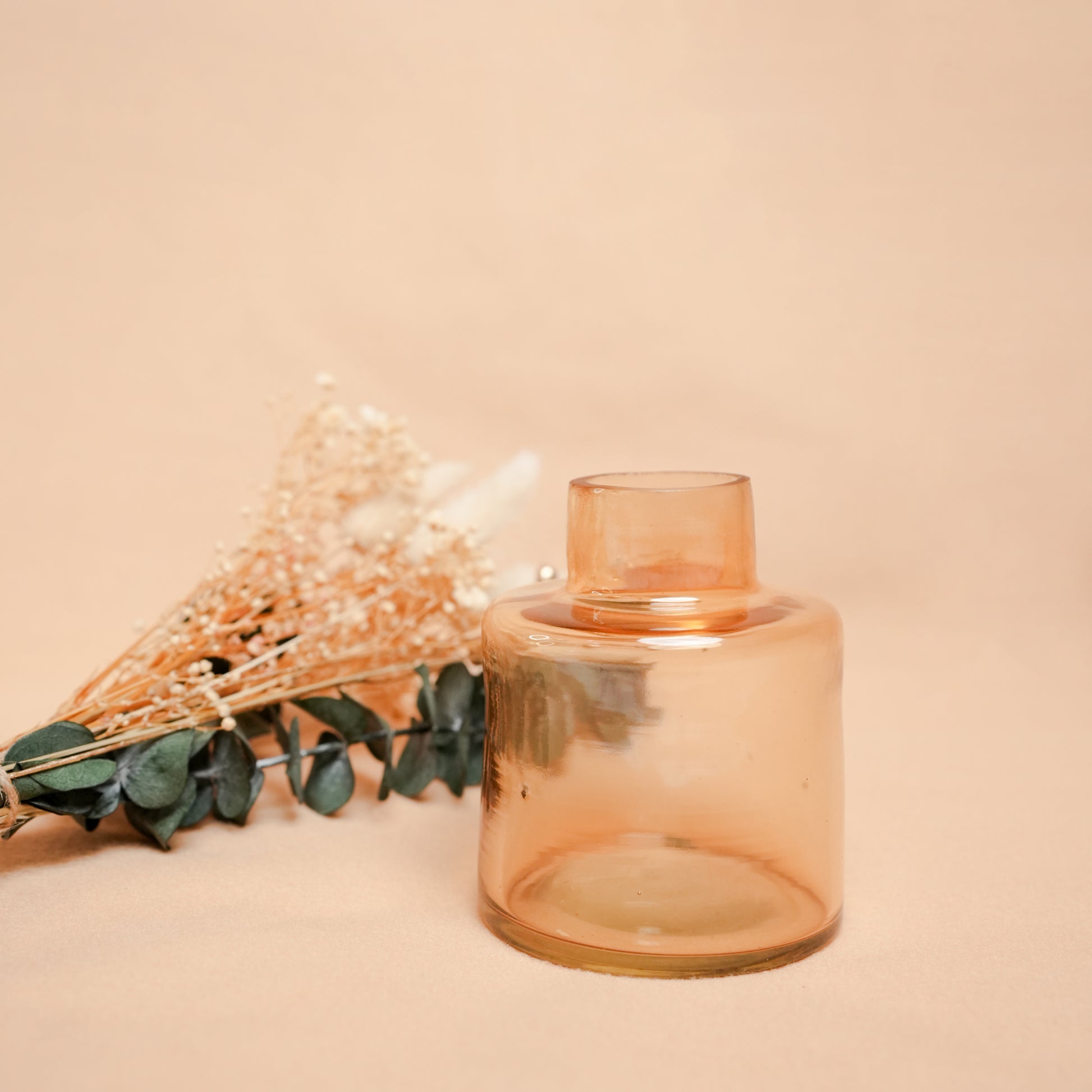 little blossom vase with dried flower bunch in mini glass vase