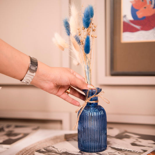 Ocean blue vase with dried flower bunch