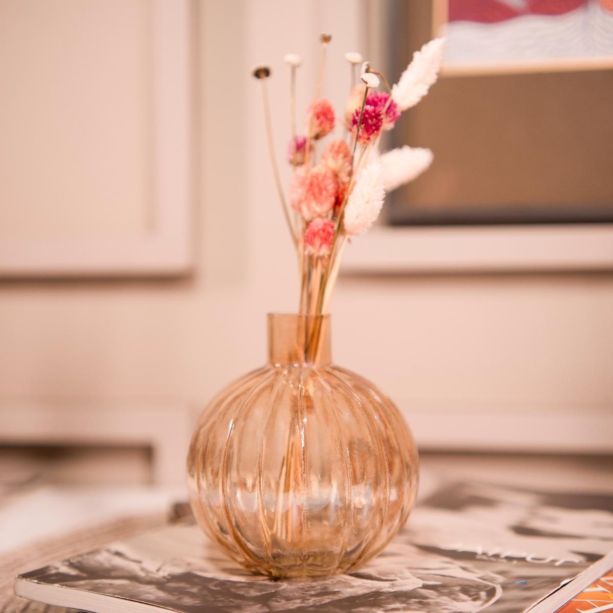 Pumpkin vase with dried flower bunch