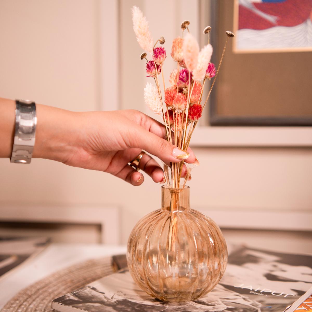 Pumpkin vase with dried flower bunch