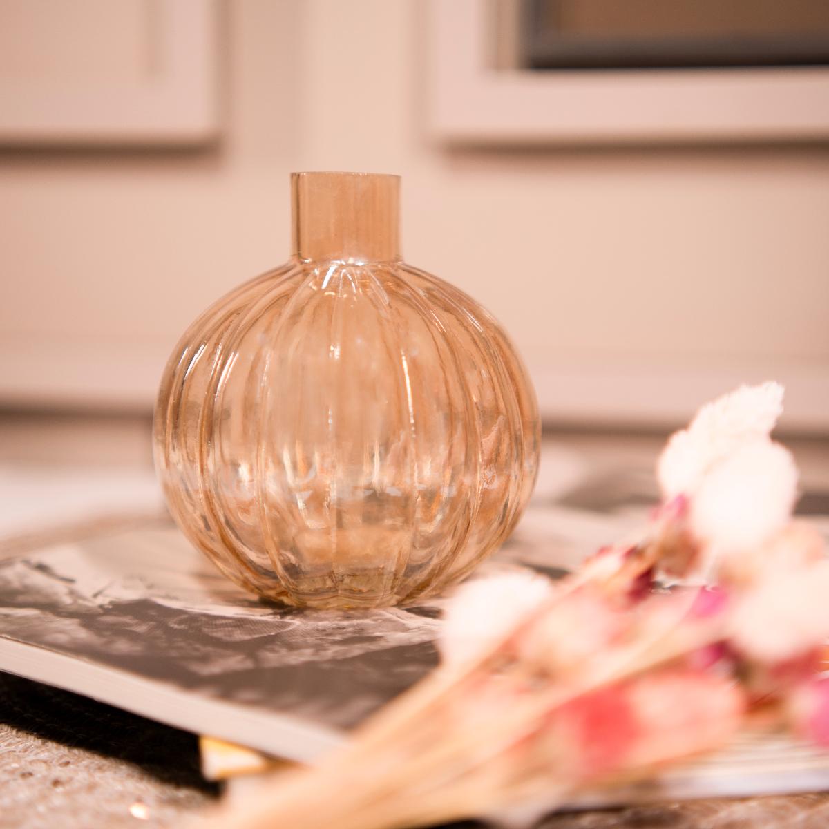 Pumpkin vase with dried flower bunch