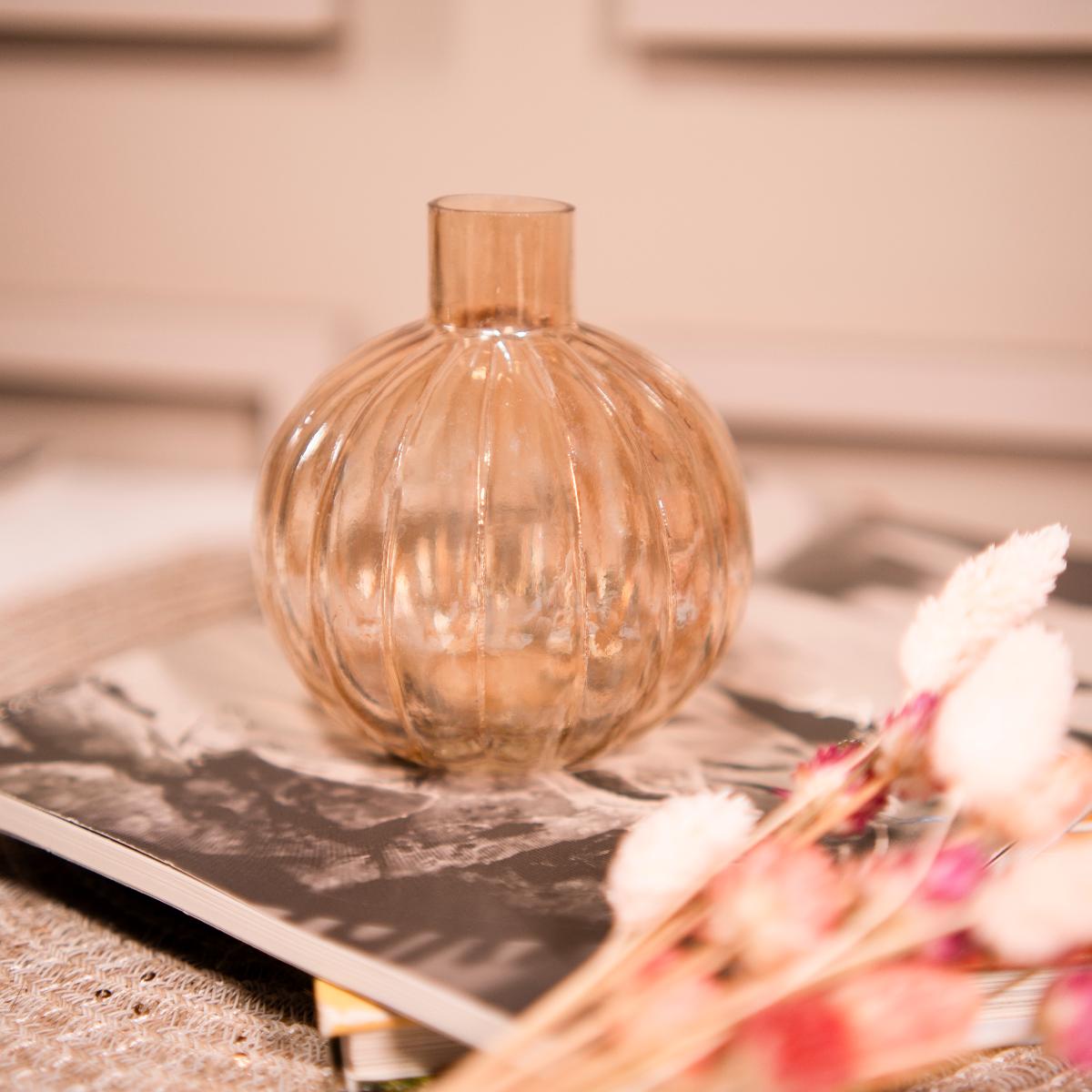 Pumpkin vase with dried flower bunch