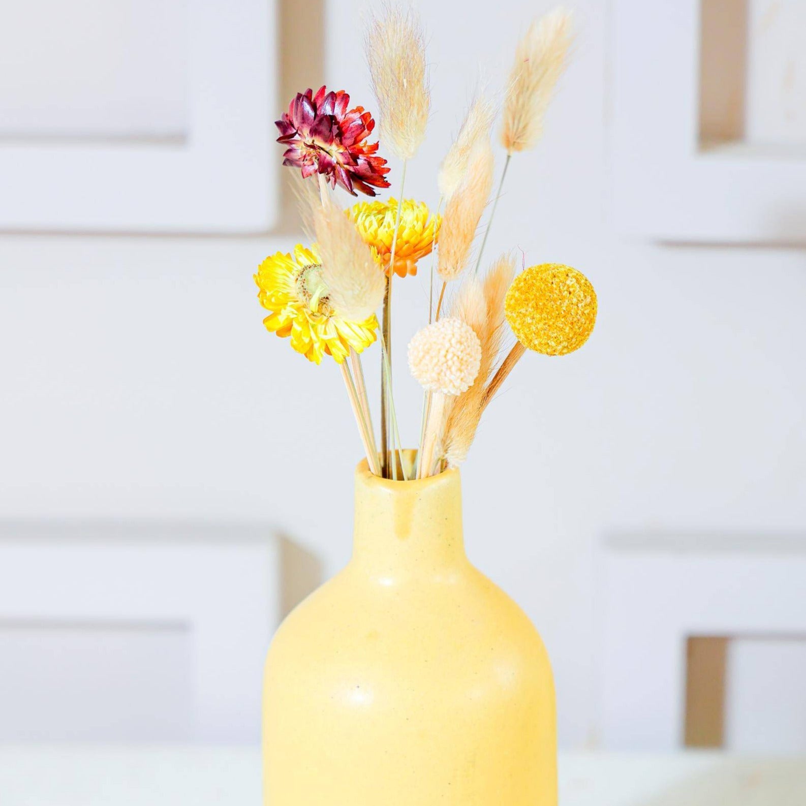 Bottle vase with summer breeze bunch