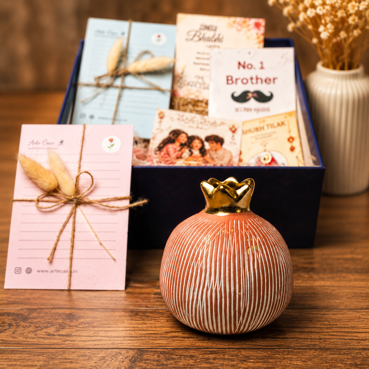 Artecasa Pink Pomegranate Rakhi Gift Hamper | Premium Bhai Bhabhi Raksha Bandhan Gift Hamper with Decorative Vase, Rakhi Set & Festive EssentialsArtecasa Pink Pomegranate Rakhi Gift Hamper | Premium Bhai Bhabhi Raksha Bandhan Gift Hamper