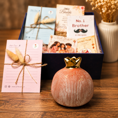 Artecasa Pink Pomegranate Rakhi Gift Hamper | Premium Bhai Bhabhi Raksha Bandhan Gift Hamper with Decorative Vase, Rakhi Set & Festive EssentialsArtecasa Pink Pomegranate Rakhi Gift Hamper | Premium Bhai Bhabhi Raksha Bandhan Gift Hamper