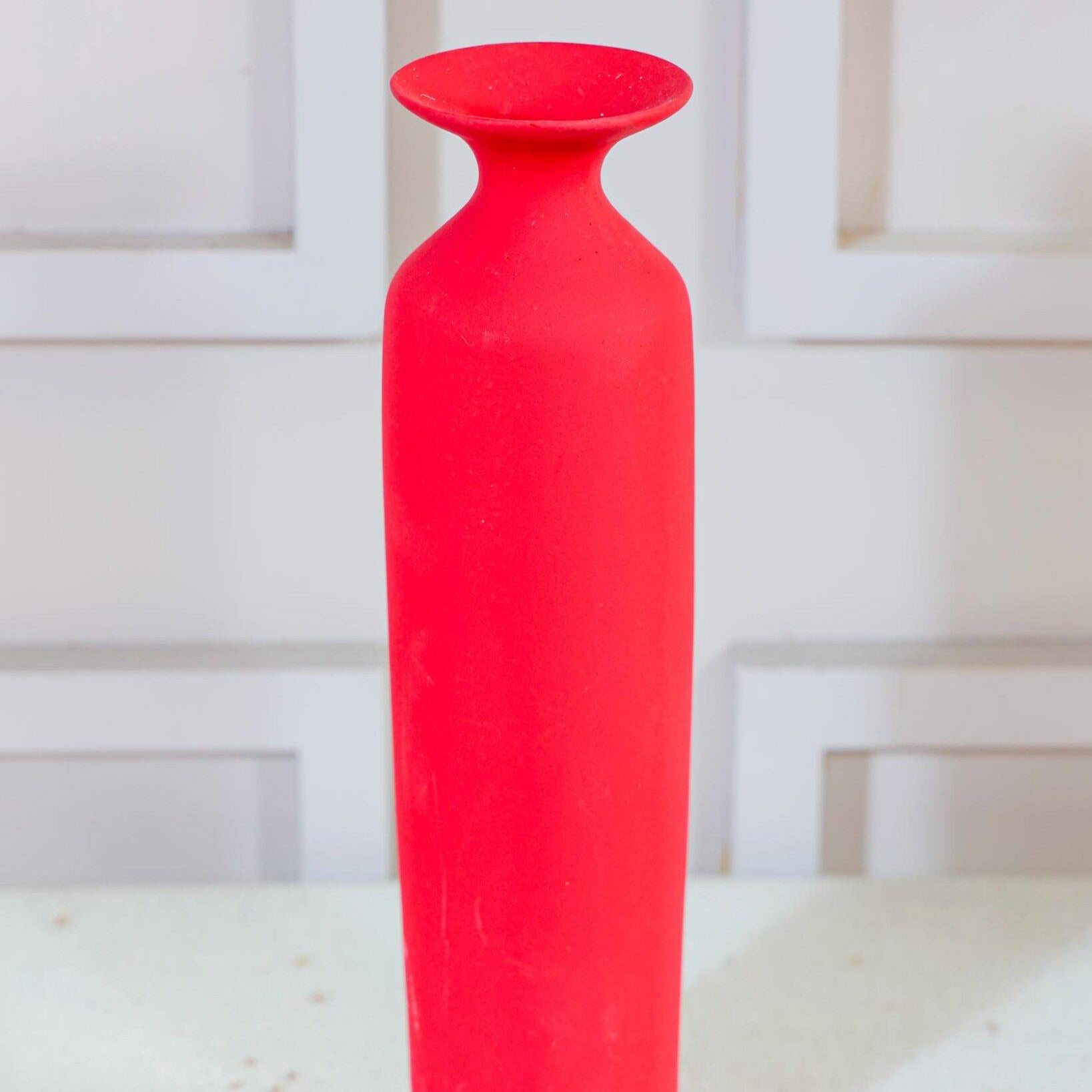 Red long vase with white reed pampas